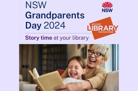 Grandma reading to grand daughter